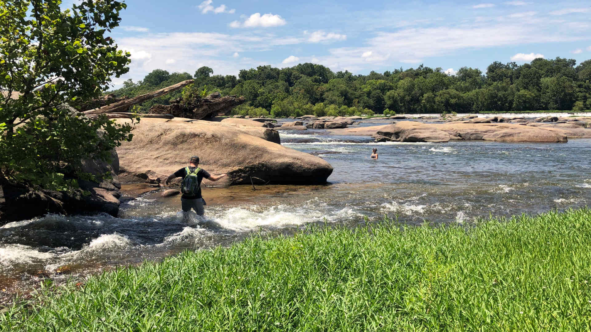 Wading across the river to enjoy the quickly moving water and cool off from our hiking.