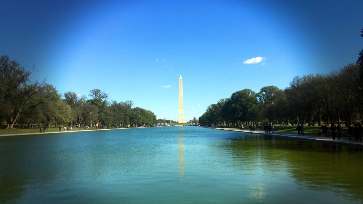 DC city life vs country life: A shot of Washington DC's monument across the reflecting pool.