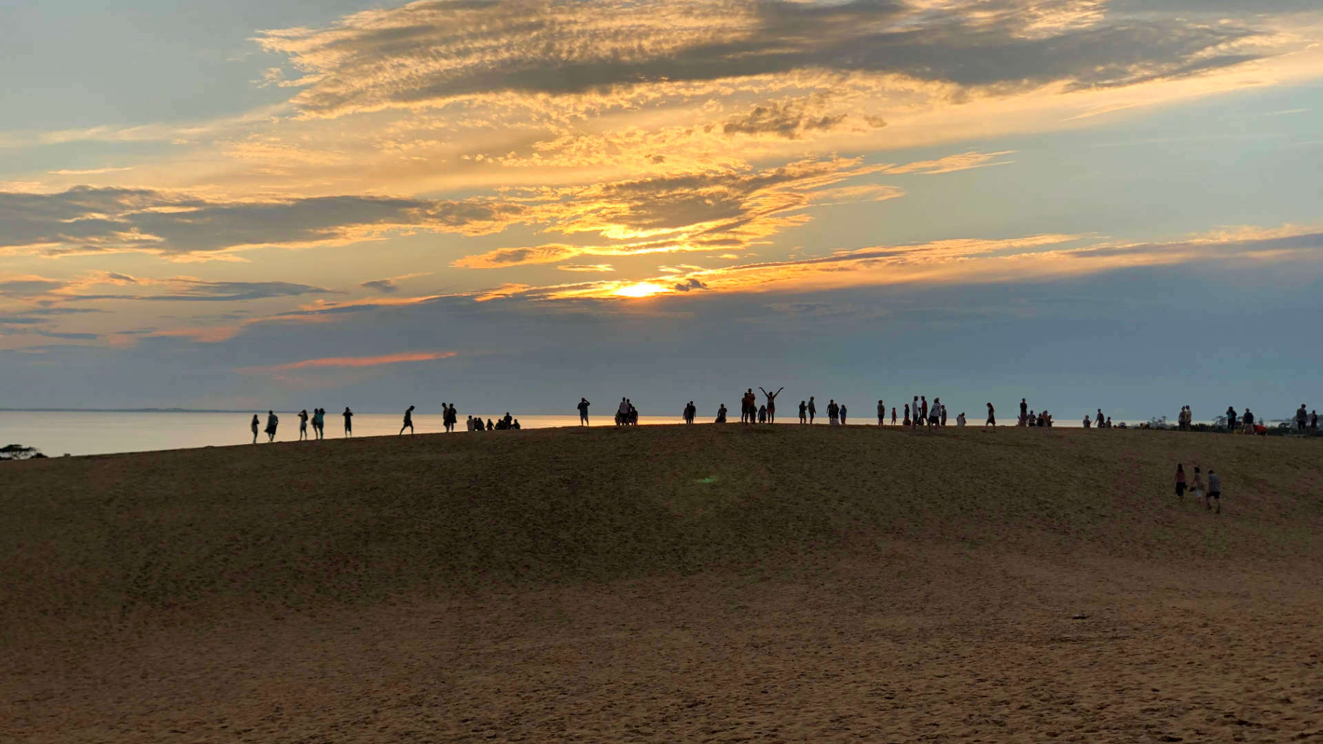 Climbing Kitty Hawk's dunes to get a view of the sound.