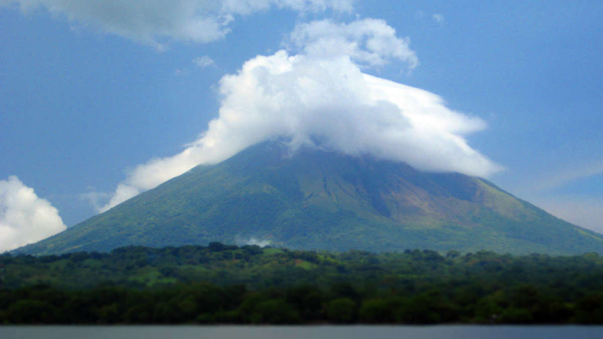 Don't let comparison be the thief of joy in your life. Comparisons are shrouded in haze not unlike the summit of financial independence. Photo: Concepción volcano in Nicaragua before our hike.