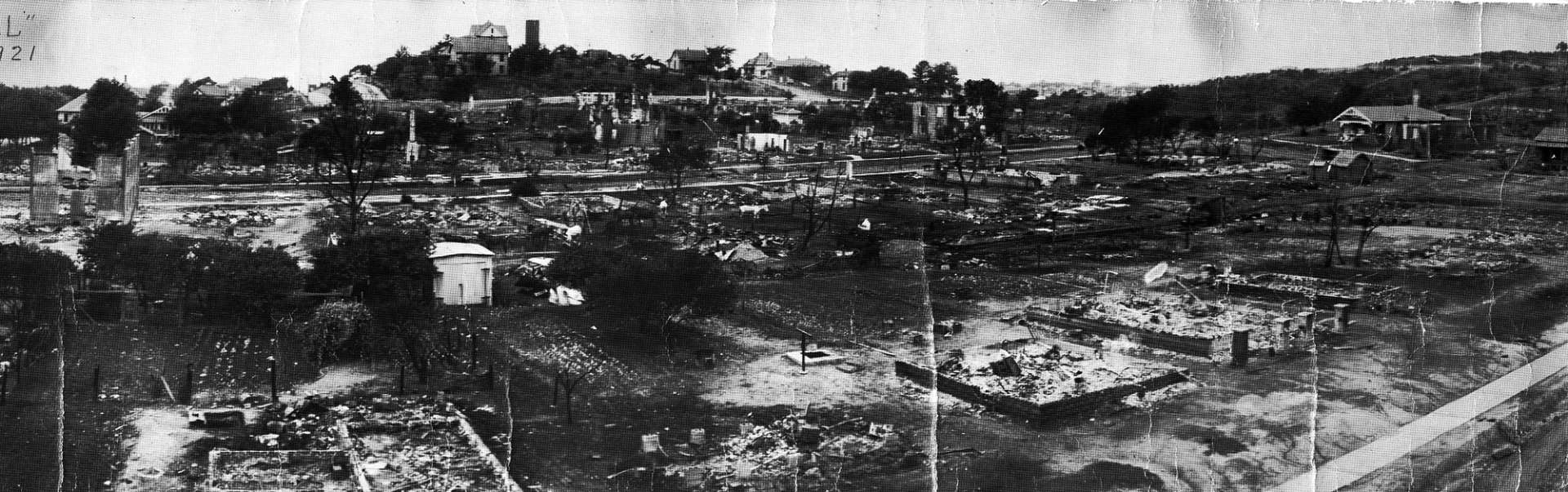 The destruction of Black Wall Street during the Tulsa Race Massacre, 1921. Image: Standpipe Hill destruction [source: OSU Digital Collections].