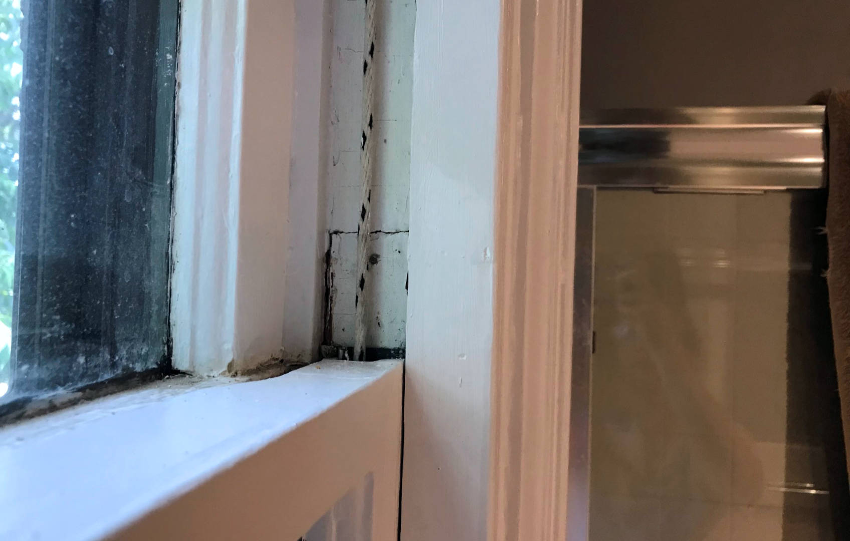 Once your window sash is reinstalled, it'll be too late to paint behind the sash cord!