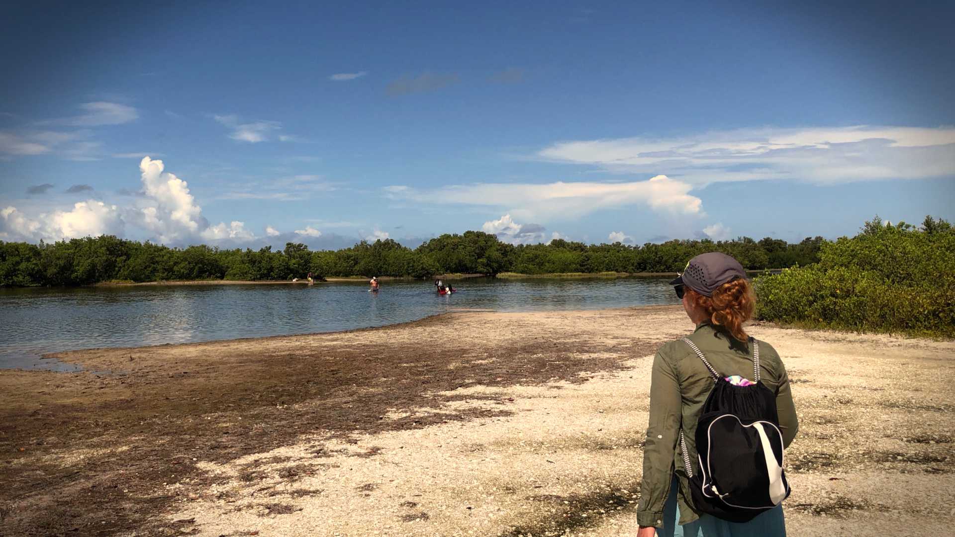 Tigertail Beach's lagoon, separating the wilder beach from the more accessible parts. Another family was coming back across toward us.