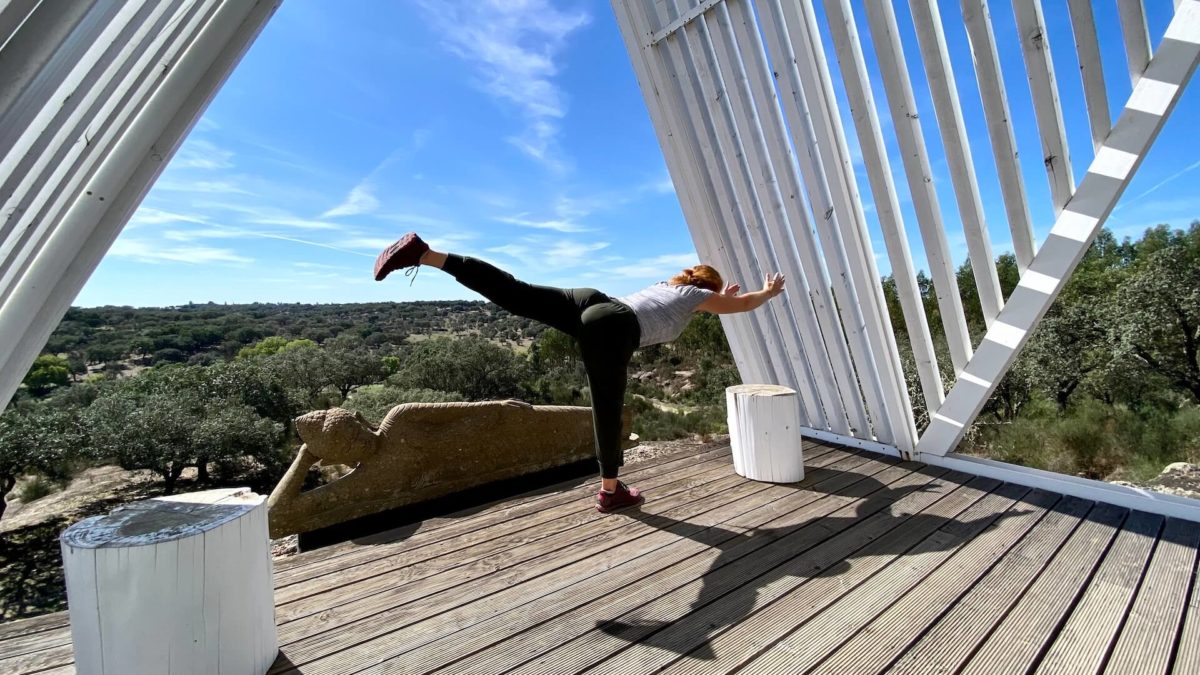 Jenni stretching herself through an impressive view across Portugal's Alentejo region. Not a bad FIRE life!