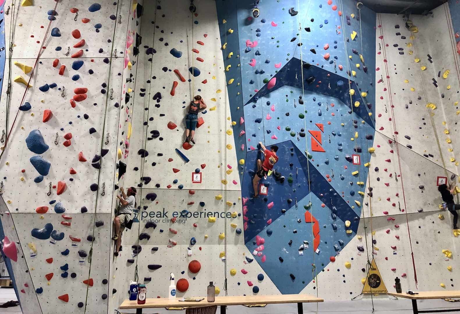 Jenni taking on her latest climbing route challenge at our home gym.