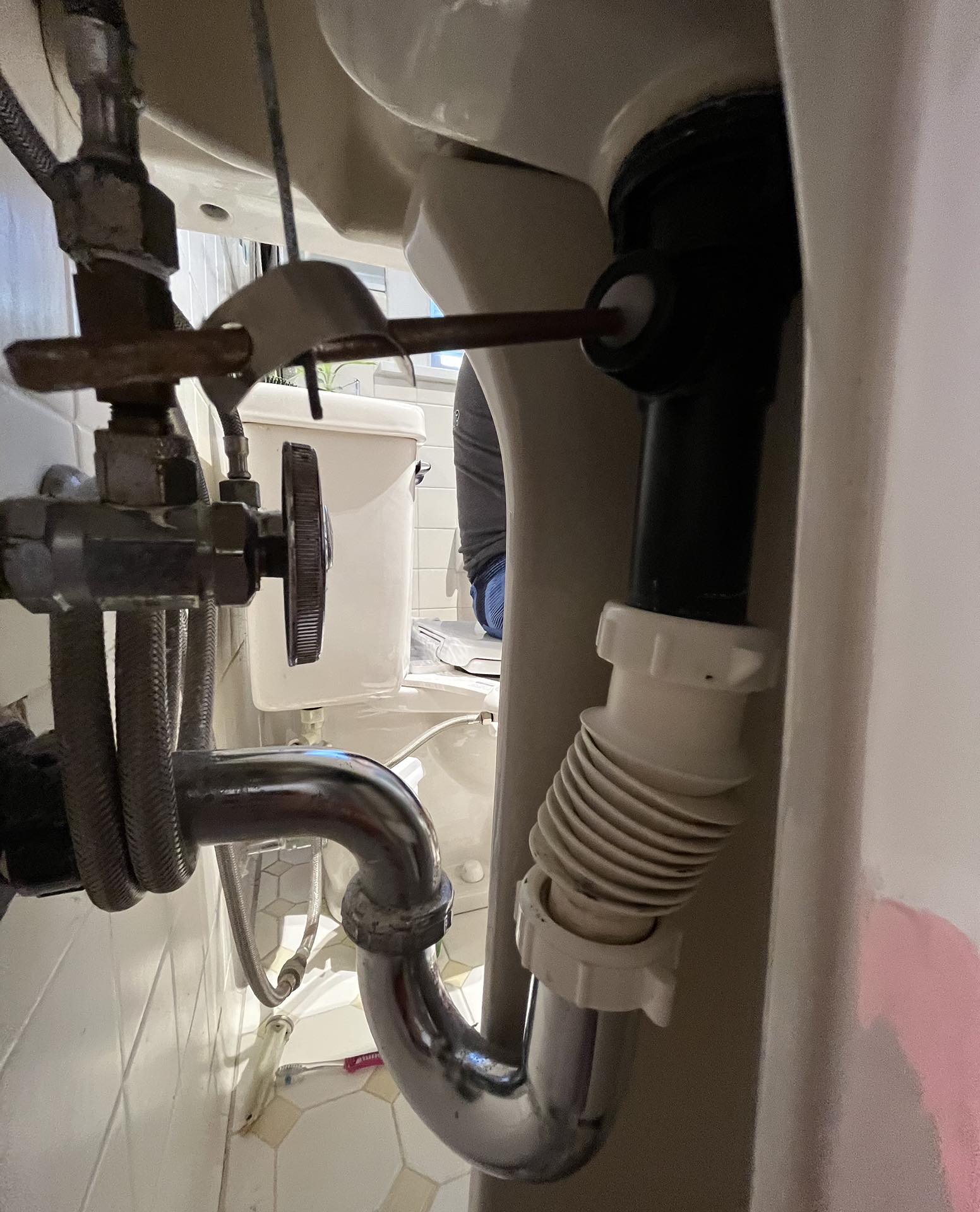 Accessing this sink drain pipe and attempting to fish out a small part was...not fun!