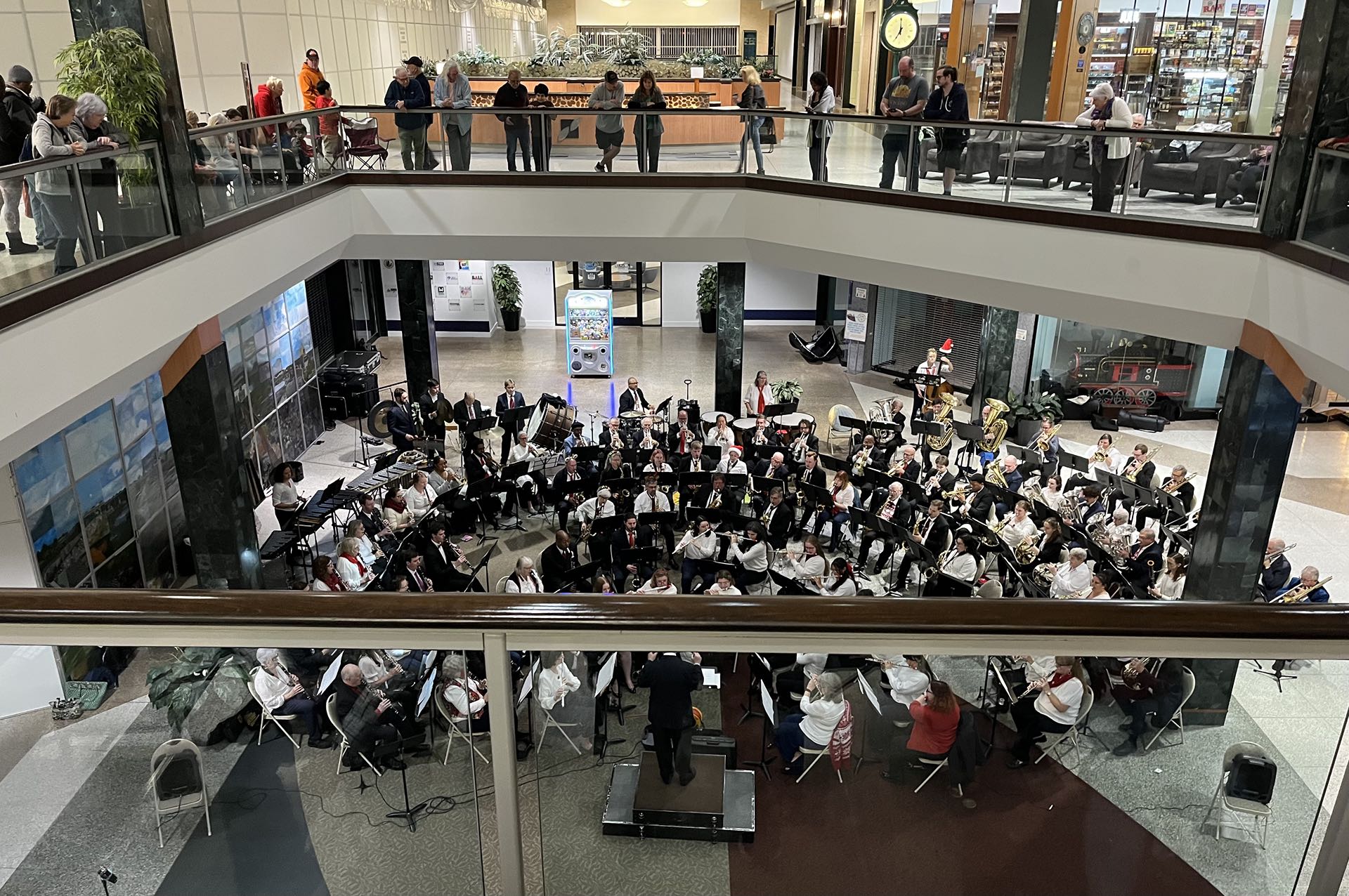 Kicking off the holiday season with our local Concert Band playing in several venues nearby—this one, a local mall! A fun use for an otherwise underused place. Carols and pops bring out the joy!