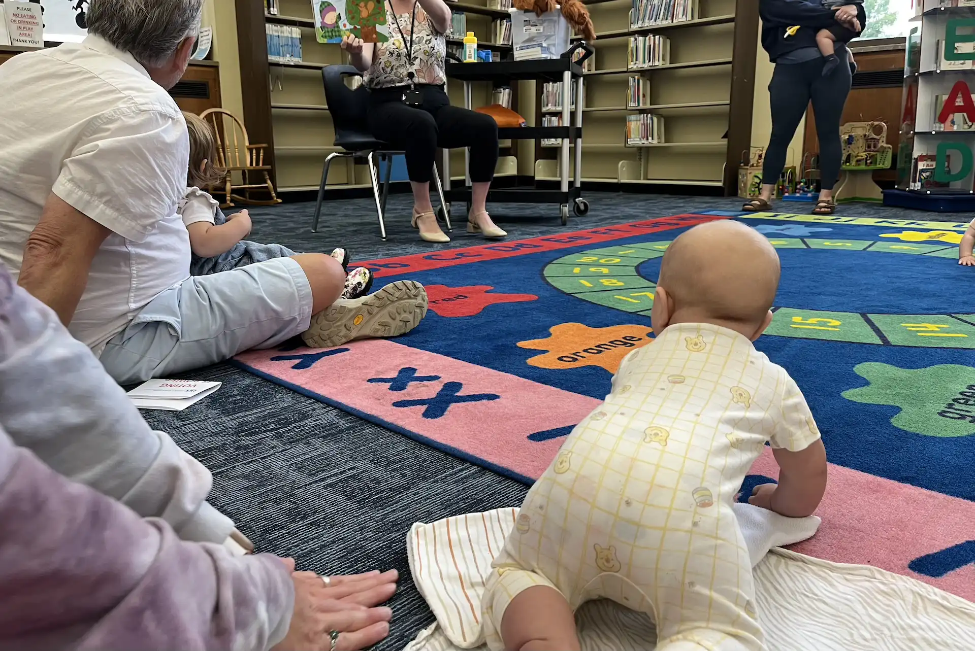 Lukas working on his crawling at our local library's "book babies" event held weekly. We love finding these little baby-friendly events, and Lukas loves socializing with his big smiles. Free, educational, and fun. Hard not to love!